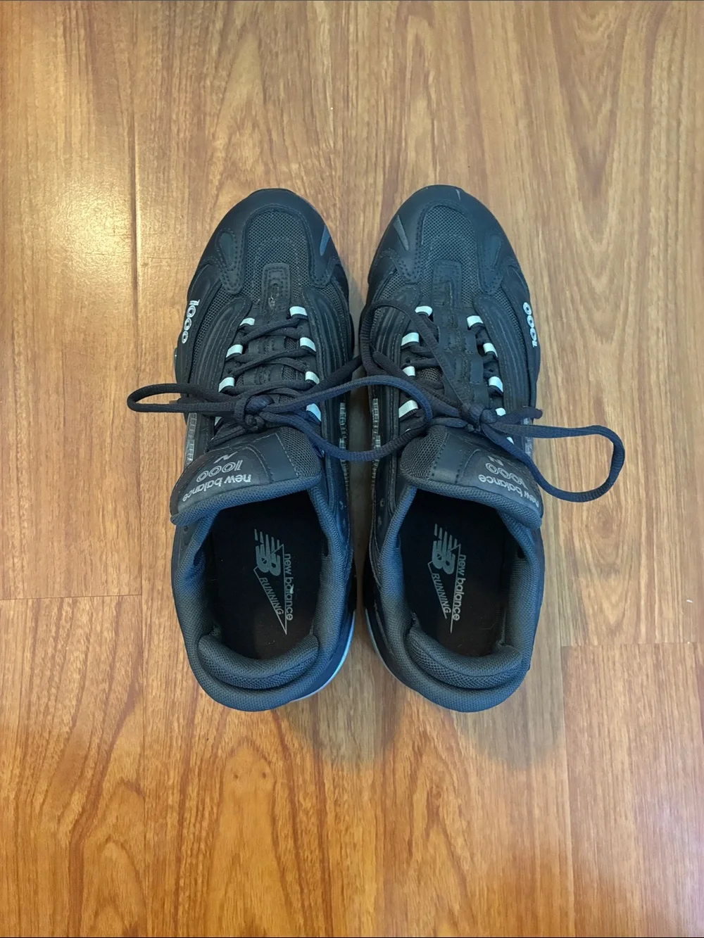 New Balance Men's Black with Blue Accent Athletic Sneakers